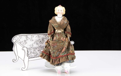 An 19th century larger scale bisque shoulder head dolls’ house doll