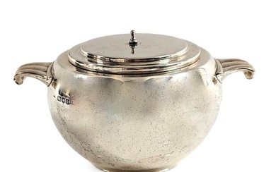 An Art Deco hallmarked silver bomb shaped twin handle sugar ...