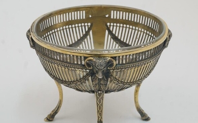 An Edward VII silver gilt sugar bowl with clear glass liner, London, 1904, Thomas of New Bond Street, of pierced oval form, with ram's heads and floral swags, on four splayed legs with cloven hoof feet, marked THOMAS 153 NEW BOND. ST to underside...