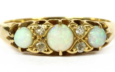An Edwardian 18ct gold opal and diamond seven stone ring