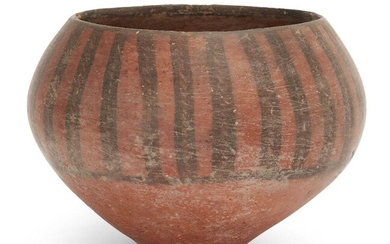 An Iranian pottery deep bowl Circa 4th-3rd Millennium B.C. the swollen body with red slip, sloping in toward the rim, decorated in black with a series of vertical lines, each with a central rope-twist pattern, 14cm. high x 18.5cm. diam. Provenance:...