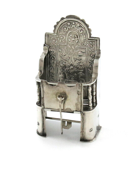 An early 18th century miniature silver fire grate with a fire-back