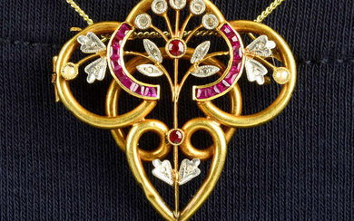 An early 20th century 18ct gold vari-cut ruby, diamond point and seed pearl pendant.