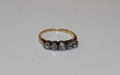 An early 20th century five stone diamond half hoop ring....