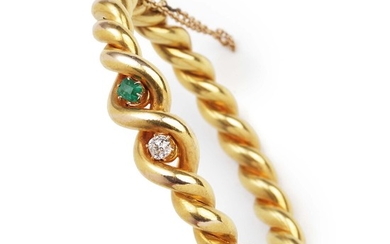An emerald and diamond bangle set with a square-cut emererald and an old-cut diamond, mounted in 18k gold. K-SI. Diam. app. 6 cm. Weight app. 28 g. Circa 1900.