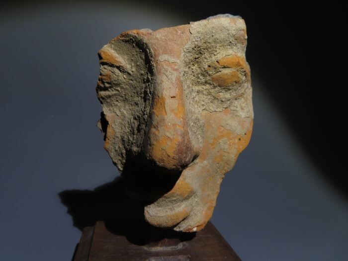 Ancient Greek Terracotta Pretty Female head. 9 cm H. 4th Century BC. Fine style
