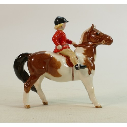 Beswick girl with red jacket on Skewbald pony 1499: With red...
