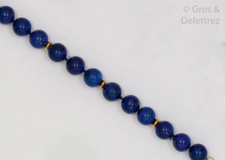 Bracelet of lapis lazuli beads alternating with yellow...