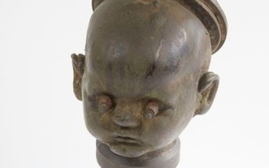 Bronze mould of doll's head, low neck, closed...