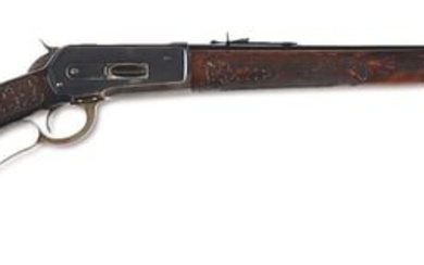 (C) RARE DELUXE WINCHESTER MODEL 1886 EXTRA LIGHT RIFLE WITH FACTORY CHEEK PIECE AND CARVED STOCKS.