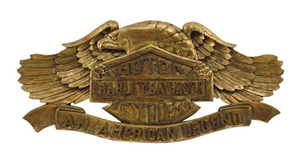 CARVED AND GILT HARLEY-DAVIDSON MOTORCYCLES SIGN IN THE FORM OF AN AMERICAN EAGLE Carved "Harley-Davidson Motor Cycles An American L...