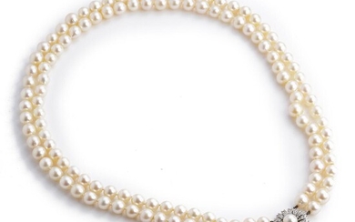 SOLD. Chr. Rasmussen: A pearl necklace with cultured pearls and diamond and pearl clasp with a cultured pearl and brilliant-cut diamonds, mounted in 14k white gold. – Bruun Rasmussen Auctioneers of Fine Art