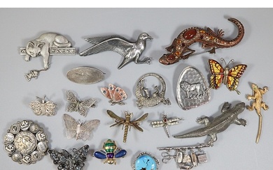 Collection of silver and other brooches: filigree designs of...