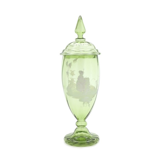 Covered green glass vase with white decoration depicting girl in garden. The end of the 19th century. H. 48 cm.