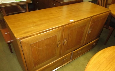 Ercol light ash sideboard, having three panelled doors with ...
