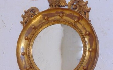 Gilt bulls eye mirror with eagle, 1930's, mirror