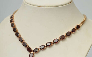 Gold necklace with garnets 20th century. Gold, 585th proof. Weight 45.63 g. Circumference 42 cm. total length 28 cm