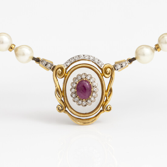ILIAS LALOUNIS, A pearl collier with a 14K and 18K gold pendan, cultured pearls, diamonds, a calcedone and ruby. Greece.