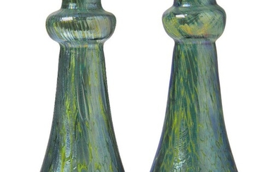 Loetz (Austrian), a matched pair of iridescent Creta Papillon glass vases, c.1900, ground out pontil, Each of tapered form with knopped and flared neck, the green body decorated with splashes of silvery-blue iridescence, 13.8 & 13.5 cm high...