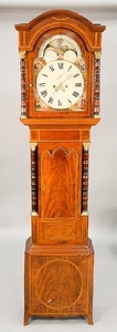 Mahogany tall clock having tombstone moon phase dial