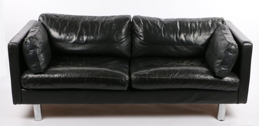 Mid 20th Century three seat settee, with black leather back, seat and arm cushions, raised on chrome