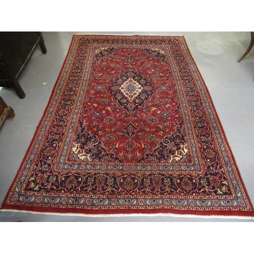Middle Eastern design Kashan carpet on a multi-coloured styl...