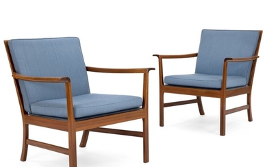 Ole Wanscher: A pair of easy chairs of mahogany. Cushions in seat and back upholstered with blue wool. Made by cabinetmaker A.J. Iversen. (2)
