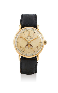 Omega. A Yellow Gold Triple Calendar Wristwatch with Moon-Phases