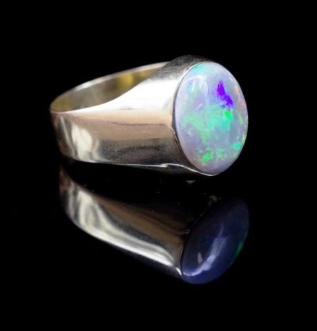 Opal and 14ct yellow gold ring marked 585. Approx cabochon s...