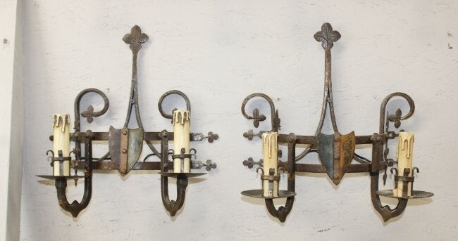Pair of French wrought iron castle sconces with shields