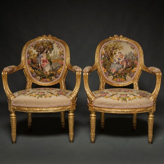 Pair of Louis XVI style French armchairs in carved and...