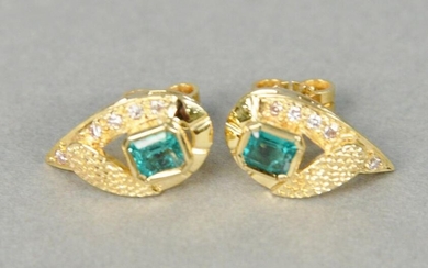 Pair of gold, emerald, and diamond earrings centering