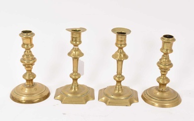 Pair of mid 18th century brass candlesticks and another pair. (4)
