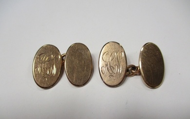 Pair of oval 9ct gold cufflinks with chain and monogram fron...
