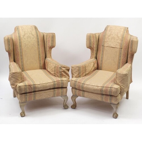 Pair of wingback armchairs with ball and claw feet and strip...