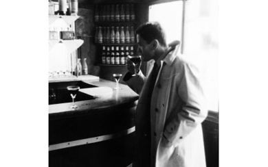 ANDRE' MORIAN ( 1938 ) , Pier Paolo Pasolini al bar 1960 ca. Vintage gelatin silver print. Photographer's credit stamp verso. 4.52 x 6.85 in.