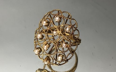 Ring made of twisted gold wire, decorated with...