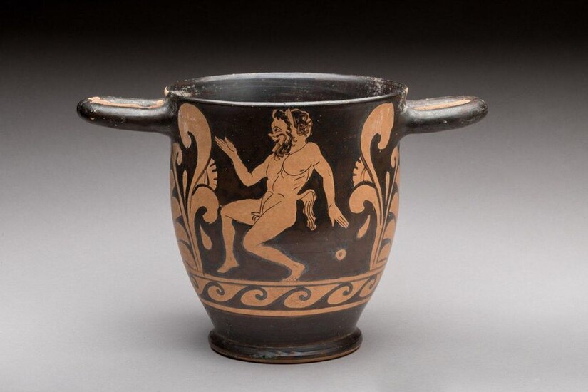 SKYPHOS with RED FIGURES in DANCING SATYRE with nude woman on one side. On the other, a dancing satyr. Paestum? IVth century B.C. Height. 14.2 Diam. 12.8 cm. Provenance : collection of an honorary consul of France, Touraine. Red-figure skyphos with...