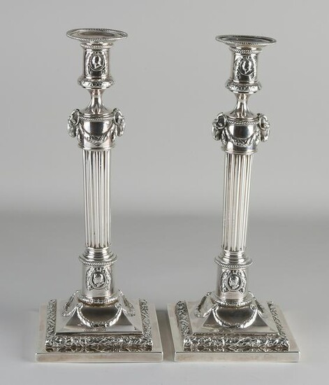 Set of capital silver candlesticks, Empire style, on a