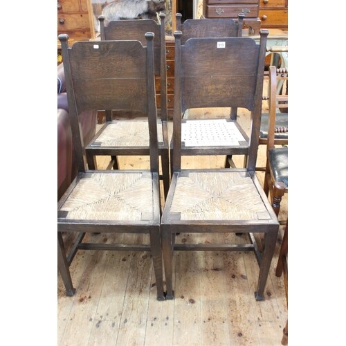 Set of four oak Arts & Crafts dining chairs in the manner of...