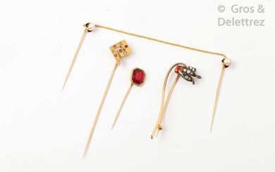 Set of four yellow gold tie pins, the...