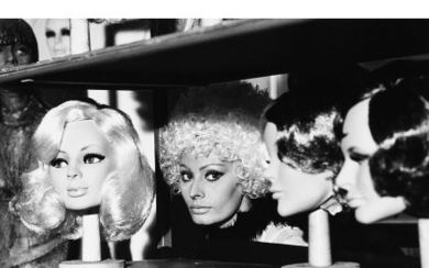 TAZIO SECCHIAROLI ( Roma 1925 - Roma 1998 ) , Sofia Loren tra le parrucche 1970 Vintage gelatin silver print. Photographer's credit stamp verso. 7.54 x 5.08 in.