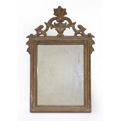 Specchiera in legno intagliato, dorato e bulinato con cimasa traforata e decorata a volute, secolo XVIII (h cm 76) (difetti)