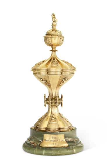 THE MANCHESTER CUP: A GEORGE V 15K GOLD PRESENTATION CUP AND COVER MARK OF OLIVANT & BOTSFORD, LONDON, 1931