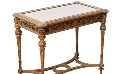 Table-vitrine sculptee en bois dore, dans l`esprit Napoleon III, fin XIXe siècle. A decor de...