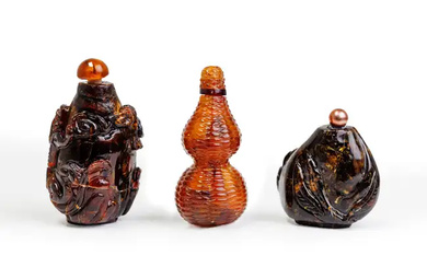 Three Chinese amber snuff bottles Late Qing dynasty The first, moulded and...