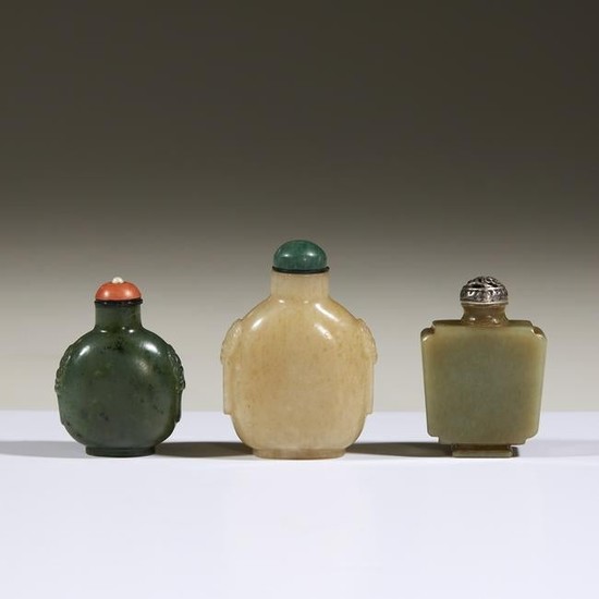 Three Chinese carved jade snuff bottles