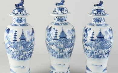 Three Chinese lidded vases, H 29 cm.