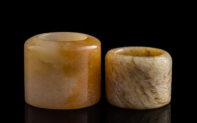 Two Chinese carved jade archer's rings, 18th/19th century