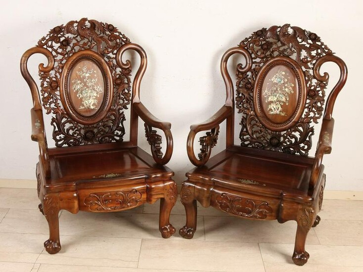Two Chinese wood carved chairs with bird of paradise /